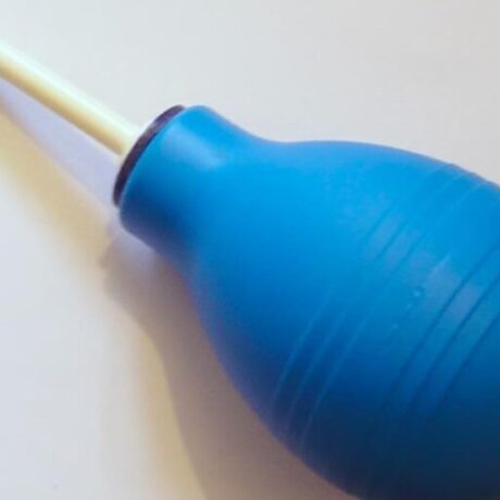 Enema can with tubing